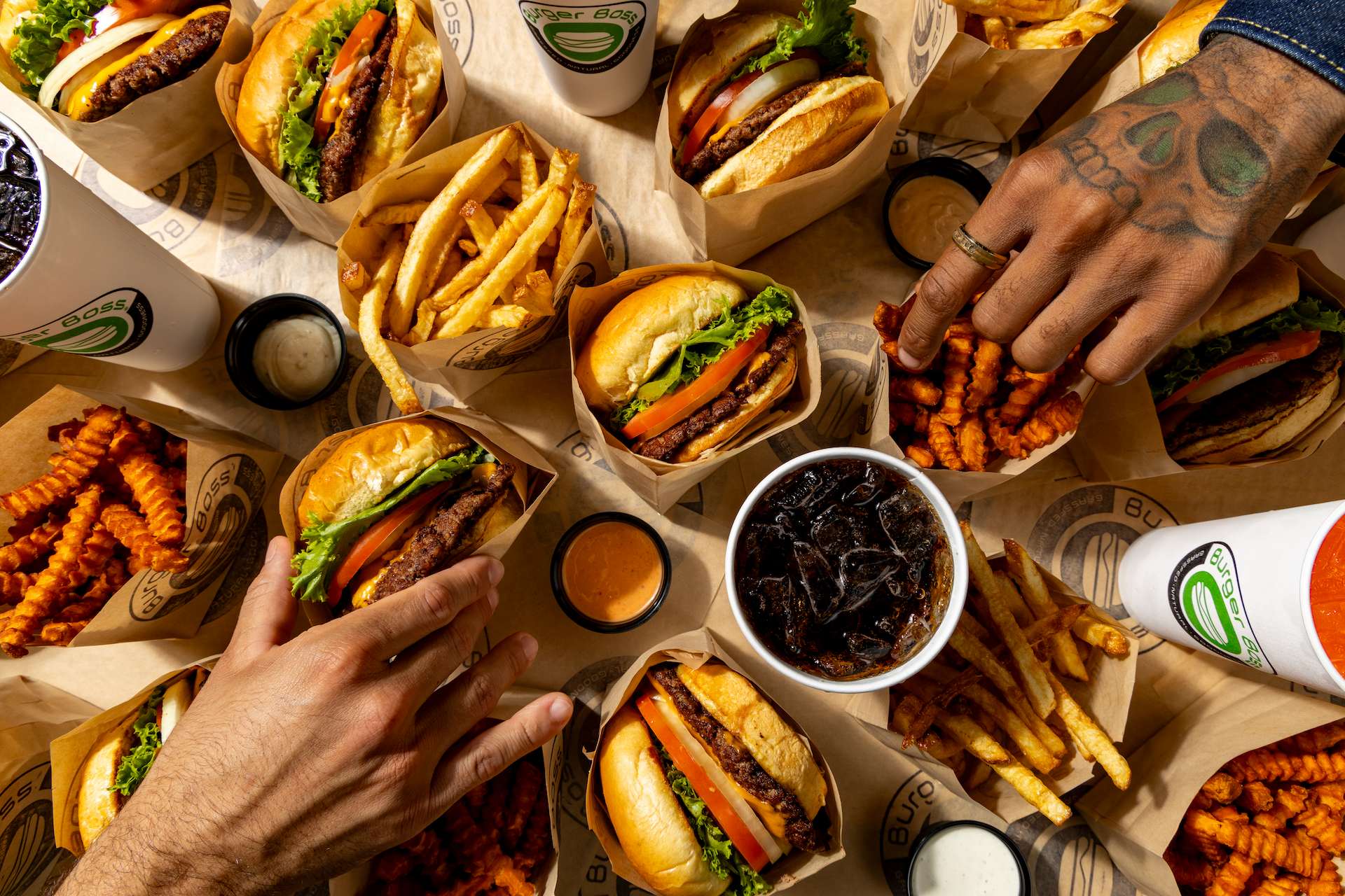 people grabbing burgers
