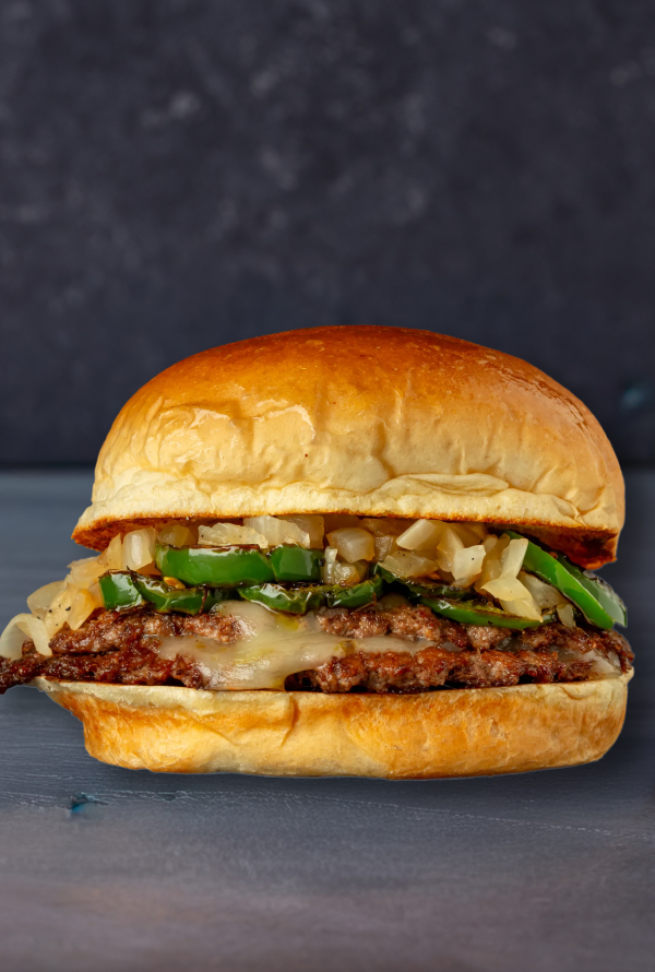 1/3 pound Grass-Finished Beef, smashed into 2 patties, seasoned with Smokey Honey Habanero spices, Pepper Jack Cheese, Grilled Onions + Jalepenos, drizzled with Spicy Fuego Sauce. Served on a Brioche Bun